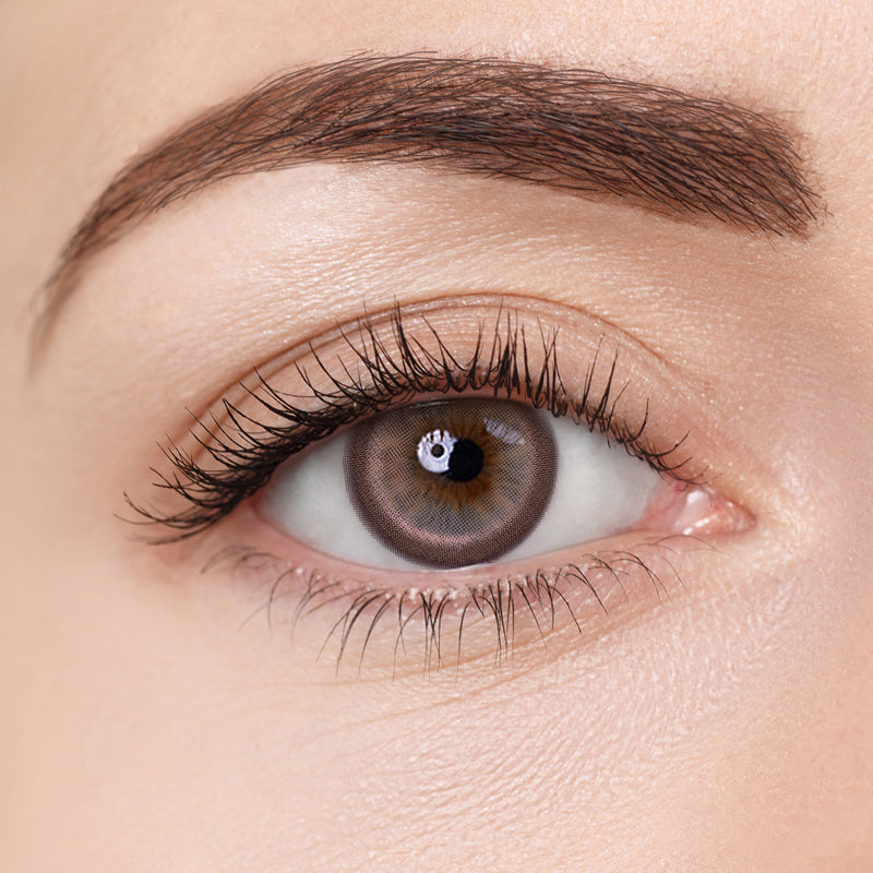 Aura Lens colored contact lenses in Rock Brown – deep, earthy brown lenses with a bold finish for a defined, natural eye look.