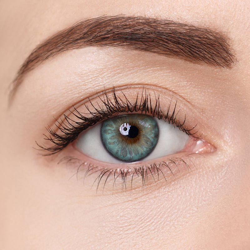 Close-up image of Aura Lens contact lens in Mintura shade, showing natural green tones designed to enhance eye color with a vibrant yet subtle look.