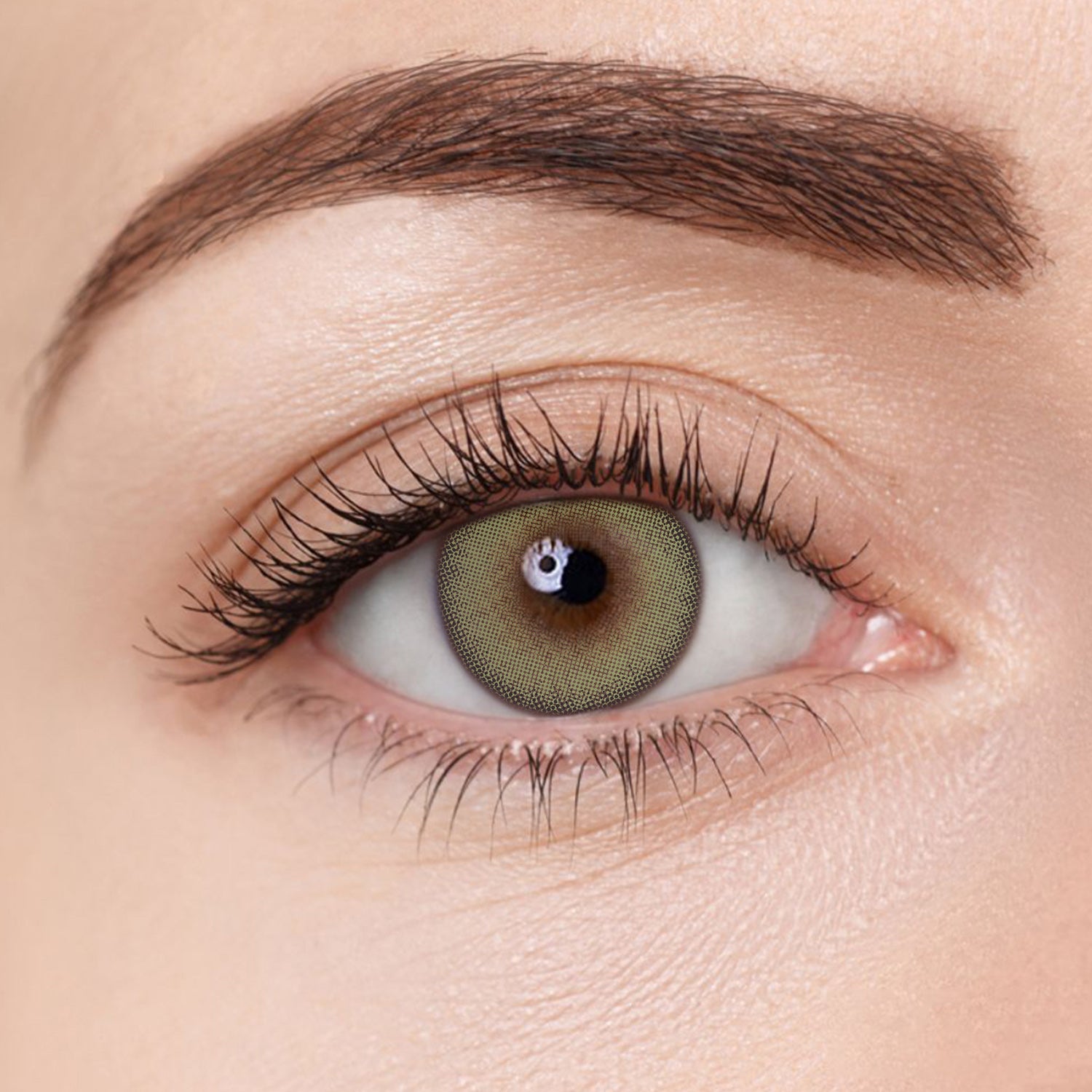 Close-up image of Aura Lens contact lens in Pastel Green shade, showing natural green tones designed to enhance eye color with a vibrant yet subtle look.